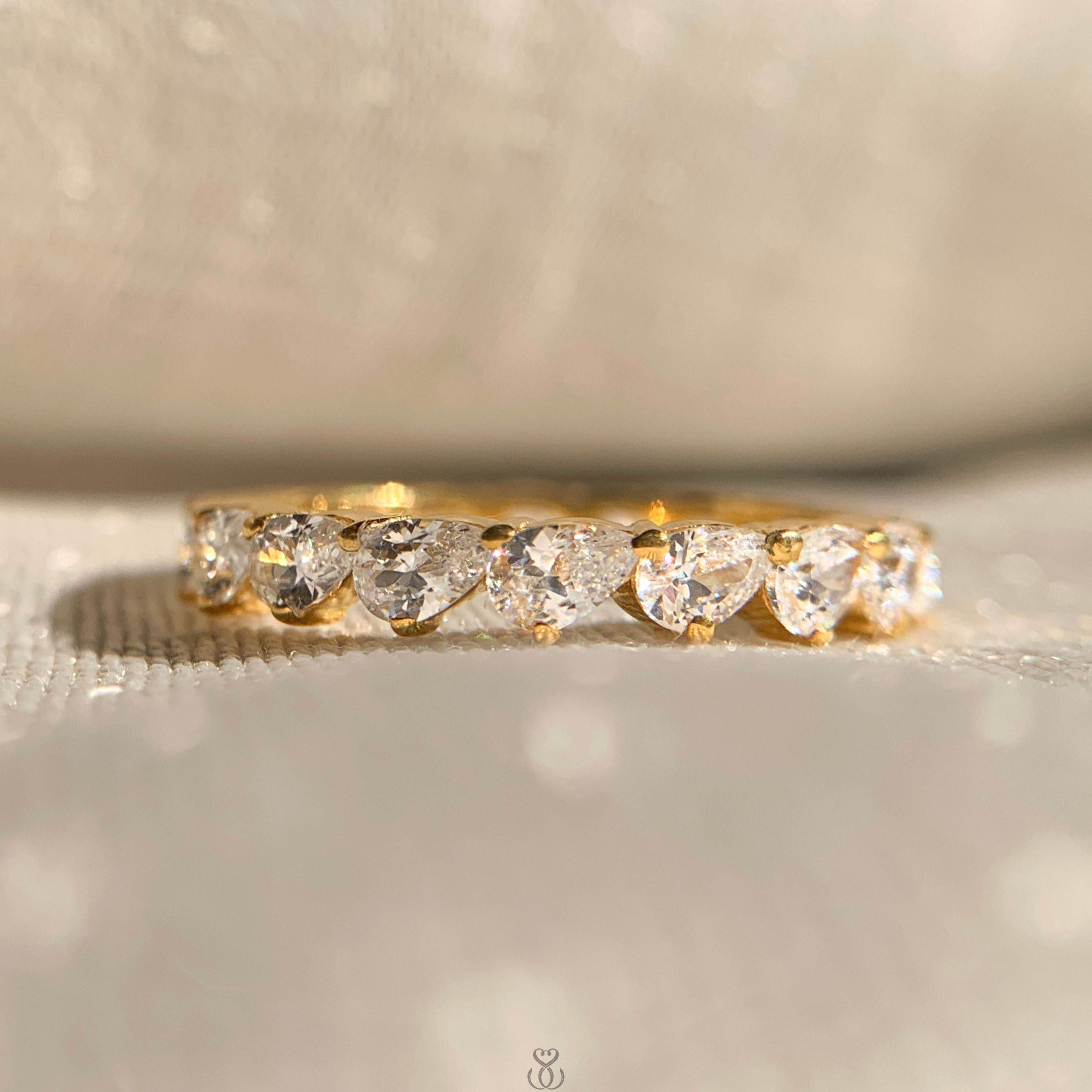 Cross pear cut full diamond eternity band in white gold for women